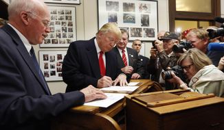 FILE - In this Nov. 4, 2015, photo, New Hampshire Secretary of State Bill Gardner watches, left, as Republican presidential candidate Donald Trump fills out his papers to be on the nation&#39;s earliest presidential primary ballot at The Secretary of State&#39;s office in Concord, N.H. A commission created by Trump to investigate his allegations of voter fraud is scheduled to meet in New Hampshire on Tuesday, Sept. 12, 2017.  (AP Photo/Jim Cole, File)