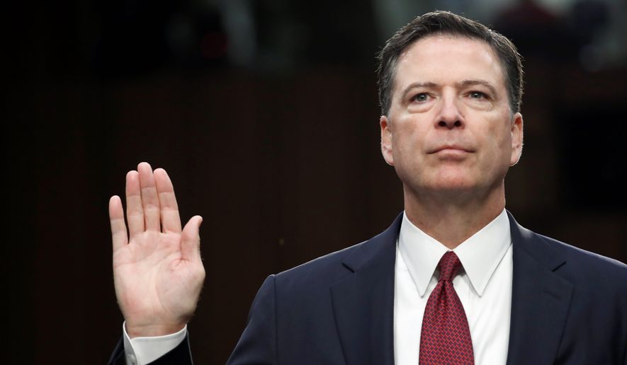Former FBI Director James Comey is sworn in during a Senate Intelligence Committee hearing on Capitol Hill, Thursday, June 8, 2017, in Washington. (AP Photo/Alex Brandon)