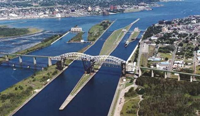 Aerial photo of Soo Locks, a vital waterway for iron ore and other maritime commerce between Lake Superior and Lake Huron that first opened in 1855. Today, only two of its four locks are operable, and only one  the Poe Lock  can handle the largest lake freighters. Image courtesy of U.S. Army Corps of Engineers.