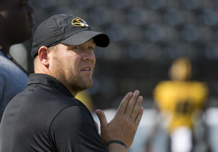FILE - In this Sept. 2, 2017, file photo, Missouri head coach Barry Odom watches his team warm up before the start of an NCAA college football game against Missouri State, in Columbia, Mo. Missouri fired former defensive coordinator DeMontie Cross after its loss the South Carolina last week, the second straight game in whcih the Tigers' defense had struggled. Coach Barry Odom is hoping for quick improvement on that side of the ball when Missouri hosts Purdue on Saturday. (AP Photo/L.G. Patterson, File)