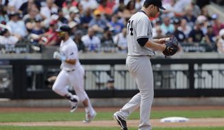 New York Yankees starting pitcher Jaime Garcia, right, reacts as Tampa Bay Rays&#39; Kevin Kiermaier runs the bases after hitting a home run during the third inning of a baseball game Wednesday, Sept. 13, 2017, in New York. (AP Photo/Frank Franklin II)