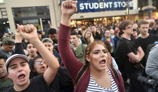 Protesters shout before a speaking engagement by Ben Shapiro on the campus of the University of California Berkeley in Berkeley, Calif., Thursday, Sept. 14, 2017. Several streets around the University of California, Berkeley, were closed off Thursday with concrete and plastic barriers ahead of an evening appearance by the conservative commentator, the latest polarizing event to raise concerns of violence on the famously liberal campus. (AP Photo/Josh Edelson) **FILE**