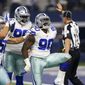 FILE - In this Sunday, Sept. 10, 2017 file photo, Dallas Cowboys&#39; Sean Lee, left, Maliek Collins (96) and DeMarcus Lawrence (90) celebrate a sack by Lawrence during an NFL football game against the New York Giants in Arlington, Texas. Lawrence had two sacks as the Cowboys held a season-opening opponent to the fewest points in 22 years in a 19-3 win over the New York Giants. (AP Photo/Roger Steinman, File)