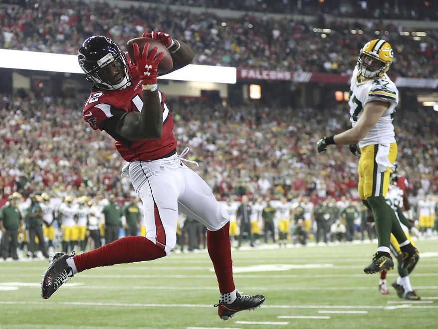 FILe - In this Oct. 30, 2016, file photo, Atlanta Falcons wide receiver Mohamed Sanu catches a touchdown pass from Matt Ryan past Green Bay Packers defender Jake Ryan for a 33-32 victory in an NFL football game in Atlanta. When the Falcons host the Packers on Sunday night, it will be both an early indicator of the NFC's balance of power as well as the third meeting between the teams in less than 11 months. All three of those games have been in Atlanta, though this one will be at a new venue. The Falcons (1-0) are making the regular-season debut at $1.5 billion Mercedes-Benz Stadium, which replaced the Georgia Dome. (Curtis Compton/Atlanta-Journal Constitution via AP, File)