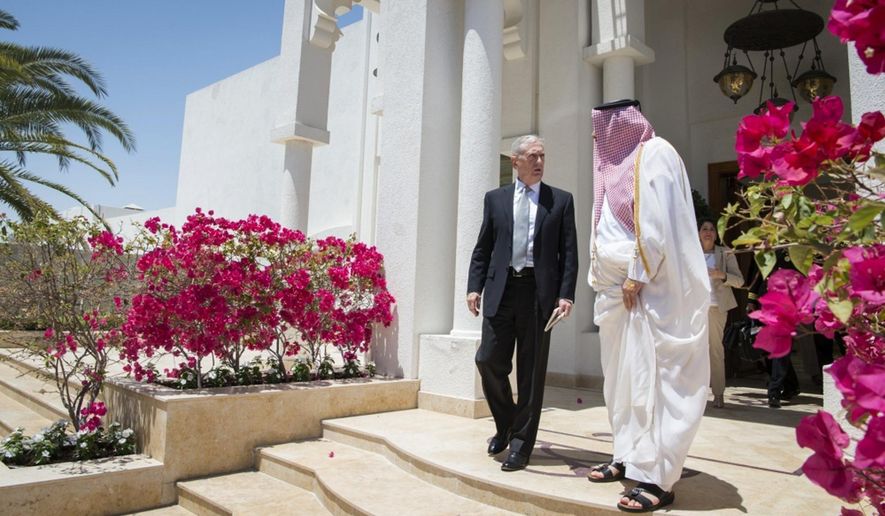 In this April 22, 2017 photo released by the U.S. Defence Department, Secretary of Defense Jim Mattis meets with Qatar&#x27;s Emir Sheikh Tamim bin Hamad Al Thani at the Sea Palace in Doha, Qatar. A trip by Qatar’s ruling emir to a major U.S. military base in his country, Monday, Sept. 11, 2017, has shown the delicate balancing act the U.S. faces in addressing the diplomatic crisis gripping Doha. (US Defence Department/ Brigitte N. Brantley via AP)