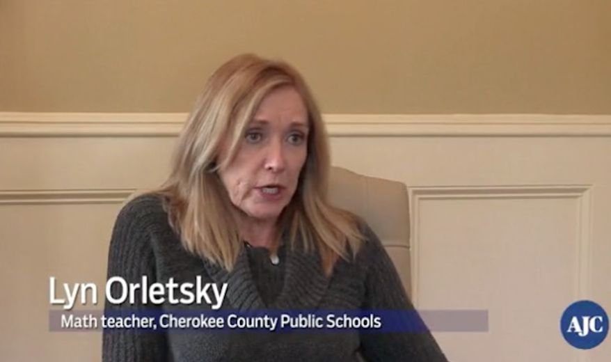 Lyn Orletsky, a teacher of five years at River Ridge High School in Woodstock, Georgia, who was yanked from the classroom after comparing President Trump's campaign slogan "Make America Great Again" to a swastika, is speaking out for the first time since video of the exchange went viral.
