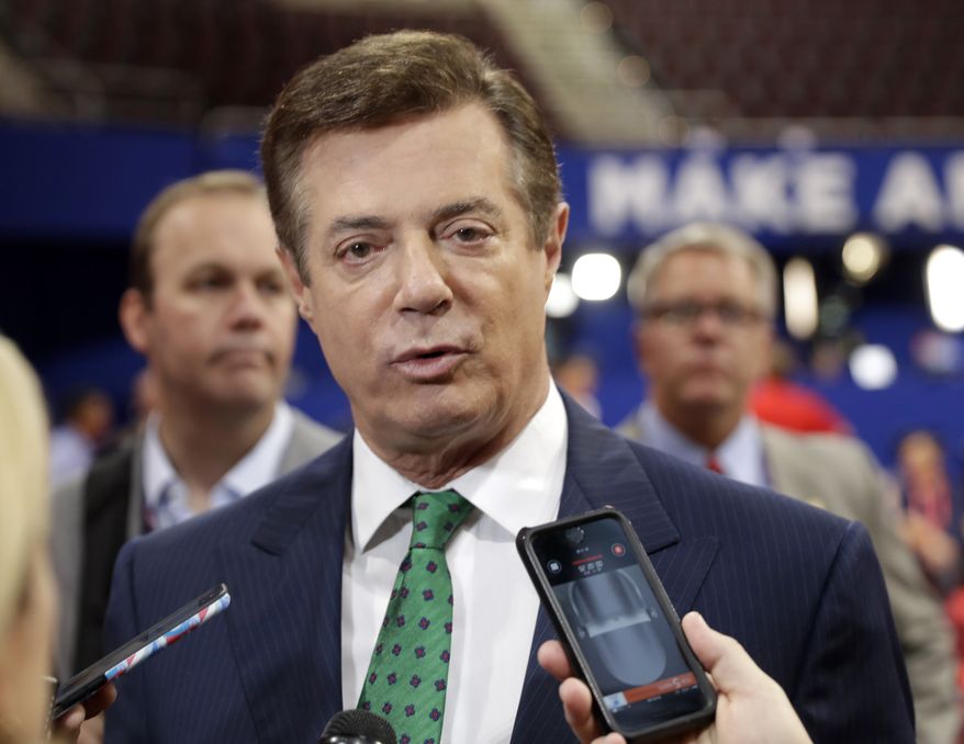 Then-Trump Campaign Chairman Paul Manafort talks to reporters on the floor of the Republican National Convention at Quicken Loans Arena in Cleveland. U.S. government investigators were wiretapping the head of Donald Trump’s presidential campaign, both before and after the election, CNN reported. (AP Photo/Matt Rourke, File)