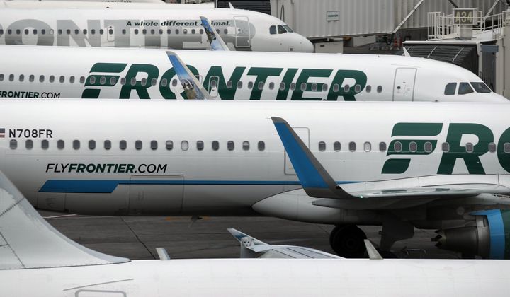 In this Monday, May 15, 2017, photograph, Frontier Airlines jets sit at gates on the A Concourse at Denver International Airport in Denver. Frontier Airlines flight 1759 was parked Thursday at the gate at Charlotte Douglas International Airport in North Carolina when it was evacuated due to a strong odor. (AP Photo/David Zalubowski, File)
