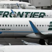 In this Monday, May 15, 2017, photograph, Frontier Airlines jets sit at gates on the A Concourse at Denver International Airport in Denver. Frontier Airlines flight 1759 was parked Thursday at the gate at Charlotte Douglas International Airport in North Carolina when it was evacuated due to a strong odor. (AP Photo/David Zalubowski, File)