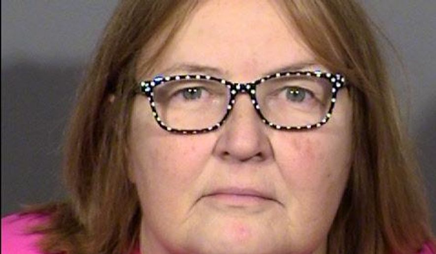 This undated photo Las Vegas Metropolitan Police Department shows Kelleen Cota, of Las Vegas. Police say the discovery of a bullet lodged in a plastic table where a former actor was shot and killed in 2013 led to Cota's arrest on Thursday, Sept. 14, 2017, on conspiracy and murder charges. (Clark County Detention Center/ Las Vegas Metropolitan Police via AP)