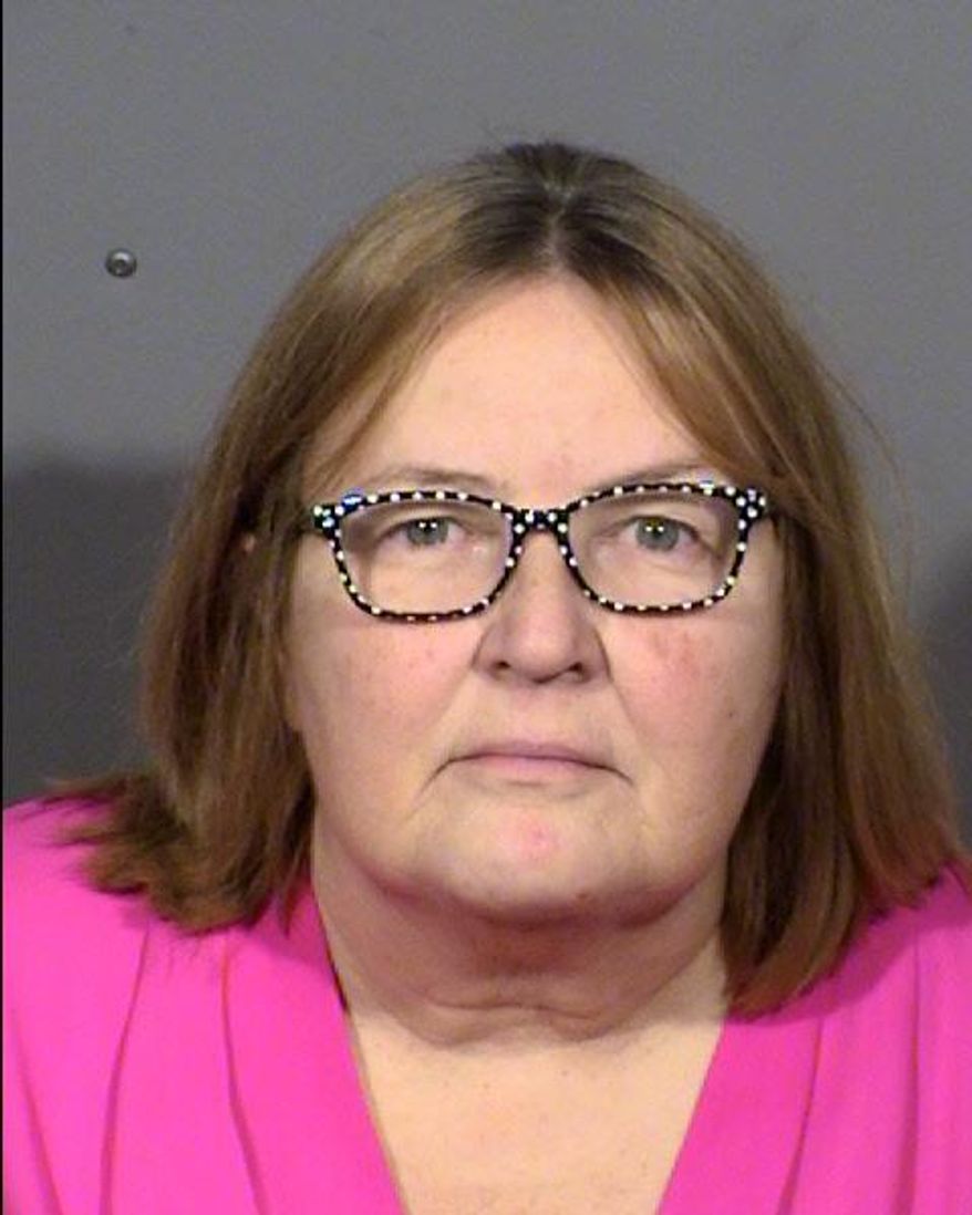 This undated photo Las Vegas Metropolitan Police Department shows Kelleen Cota, of Las Vegas. Police say the discovery of a bullet lodged in a plastic table where a former actor was shot and killed in 2013 led to Cota's arrest on Thursday, Sept. 14, 2017, on conspiracy and murder charges. (Clark County Detention Center/ Las Vegas Metropolitan Police via AP)