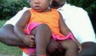 This undated family photo supplied by Christina Wilson shows Anthony Lamar Smith holding his daughter Autumn Smith. Anthony Lamar Smith was killed in 2011 during a confrontation with police. A judge may be close to a ruling in the case against Former St. Louis police officer Jason Stockley, who is charged with first-degree murder and armed criminal action in the December 2011 shooting death of Smith. Gov. Eric Greitens says he&#x27;s has put the National Guard on standby in case unrest breaks out. (Family photo courtesy Christina Wilson via AP)