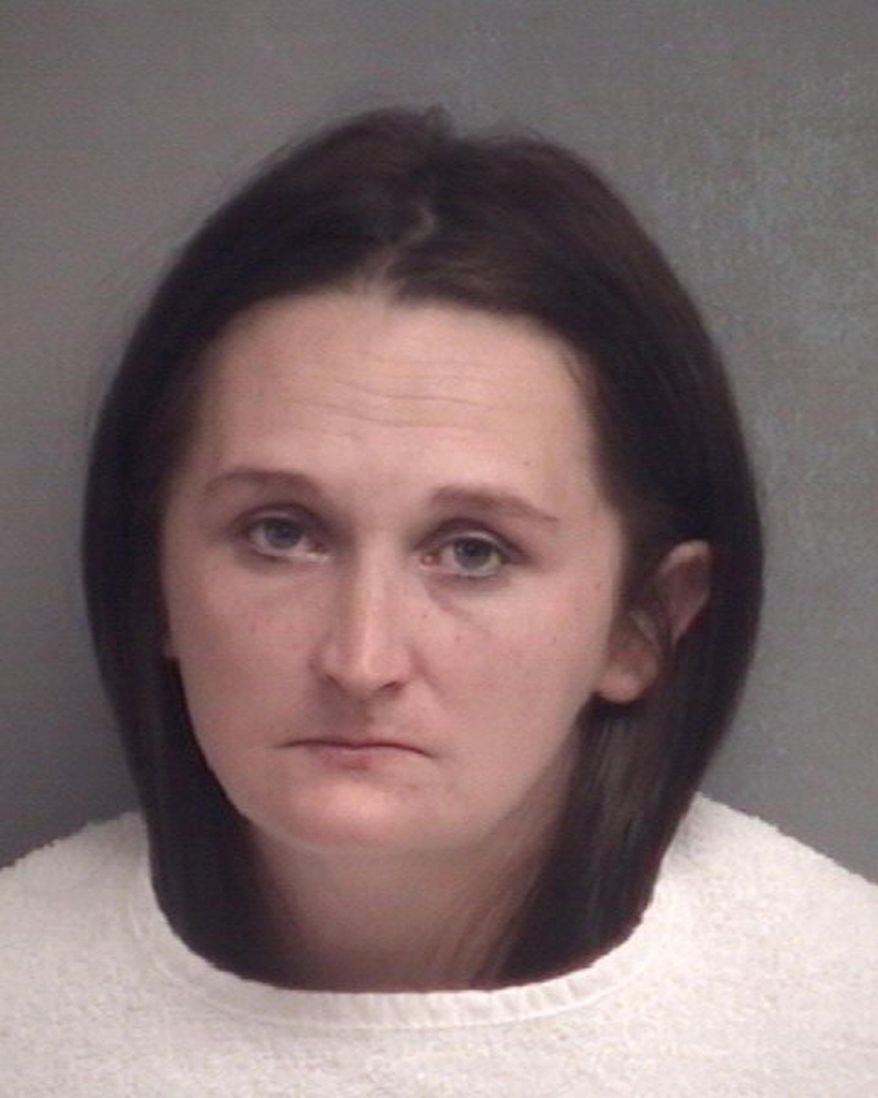 This Thursday Sept. 14, 2017 photo provided by the Joplin Police Department in Joplin, Mo., shows Lasonya Poindexter. Poindexter, a Missouri day care provider has been charged with taking a baby to Arkansas to arrange for her adoption without the knowledge of the girl's parents. Poindexter, of Joplin, was charged with attempted kidnapping Thursday. (Joplin Police Department photo via AP)
