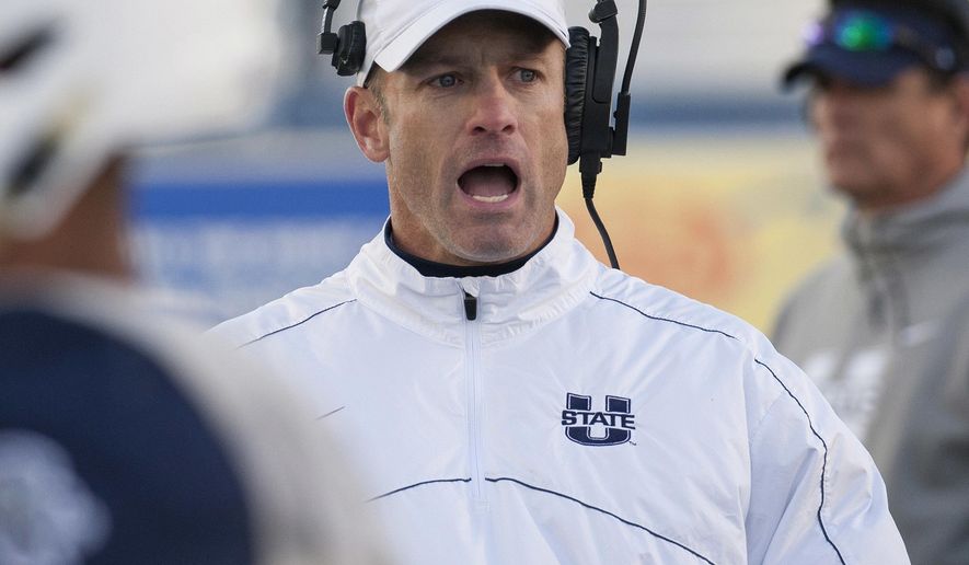 FILE - In this Saturday, Nov. 19, 2016 file photo, Utah State head coach Matt Wells on the sidelines in the second half of an NCAA college football game against Nevada in Reno, Nev. Wake Forest’s defense keeps getting the ball, and the offense keeps turning those takeaways into points. It’s added up to another strong start for the Demon Deacons. Wake Forest looks to improve to 3-0 for the second straight year on Saturday, Sept. 16, 2017 in a visit from Utah State.(AP Photo/Tom R. Smedes, File)