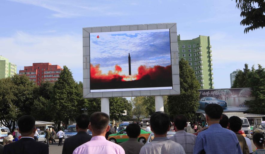 People watch a launching of a Hwasong-12 strategic ballistic rocket aired on a public TV screen at the Pyongyang Train Station in Pyongyang, North Korea, Saturday, Sept. 16, 2017. North Korean leader Kim Jong Un said his country is nearing its goal of &quot;equilibrium&quot; in military force with the United States, as the United Nations Security Council strongly condemned the North&#x27;s &quot;highly provocative&quot; ballistic missile launch over Japan on Friday. (AP Photo/Jon Chol Jin)