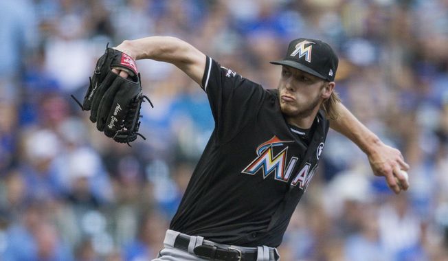 Miami Marlins&#x27; Adam Conley pitches to a Milwaukee Brewer batter during the first inning of a baseball game Saturday, Sept. 16, 2017, in Milwaukee. (AP Photo/Tom Lynn)