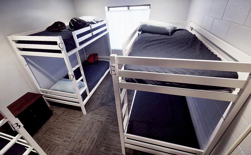 This Sept. 6, 2017 photo shows one of five emergency shelter rooms inside a newly renovated Hope Harbor Emergency Shelter in Grand Island, Neb. The expansion increased the number of beds from 12 to 26. (Andrew Carpenean/The Independent via AP)