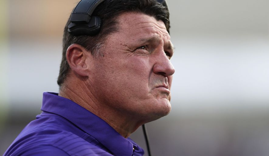 LSU head coach Ed Orgeron looks at a replay on the end zone screen during the first half of their NCAA college football game against Mississippi State in Starkville, Miss., Saturday, Sept. 16, 2017. (AP Photo/Rogelio V. Solis)