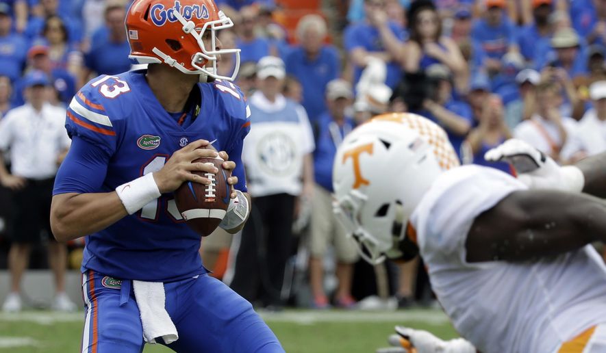 Florida quarterback Feleipe Franks (13) looks for a receiver against Tennessee during the first half of an NCAA college football game, Saturday, Sept. 16, 2017, in Gainesville, Fla. (AP Photo/John Raoux)
