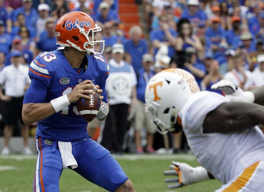 Florida quarterback Feleipe Franks (13) looks for a receiver against Tennessee during the first half of an NCAA college football game, Saturday, Sept. 16, 2017, in Gainesville, Fla. (AP Photo/John Raoux)