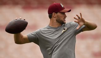 Washington Redskins quarterback Kirk Cousins warms up before an NFL football game against the Los Angeles Rams Sunday, Sept. 17, 2017, in Los Angeles. (AP Photo/Kelvin Kuo)