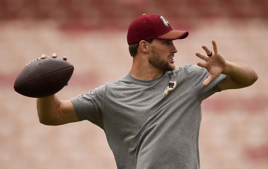 Washington Redskins quarterback Kirk Cousins warms up before an NFL football game against the Los Angeles Rams Sunday, Sept. 17, 2017, in Los Angeles. (AP Photo/Kelvin Kuo)