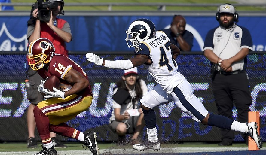 Washington Redskins wide receiver Ryan Grant catches a touchdown pass ahead of a Los Angeles Rams Kevin Peterson during the second half of an NFL football game Sunday, Sept. 17, 2017, in Los Angeles. (AP Photo/Kelvin Kuo)