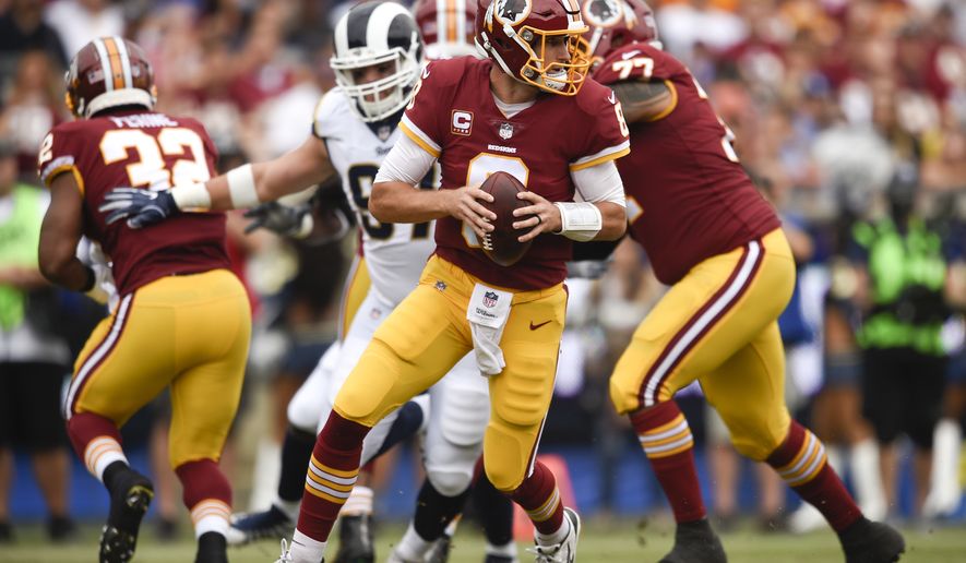 Washington Redskins quarterback Kirk Cousins plays during the first half of an NFL football game against the Los Angeles Rams Sunday, Sept. 17, 2017, in Los Angeles. (AP Photo/Kelvin Kuo)