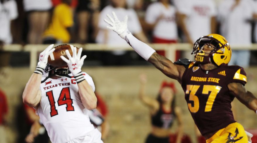 Texas Tech receiver Dylan Cantrell makes a touchdown reception while defended by Arizona State's Joseph Bryant during the first half of an NCAA college football game Saturday, Sept. 16, 2017, in Lubbock, Texas. (Mark Rogers/Lubbock Avalanche-Journal via AP)