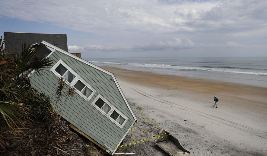 A house rests on the beach after collapsing off a cliff from Hurricane Irma in Vilano Beach, Fla., Friday, Sept. 15, 2017. Florida’s economy has long thrived on one major import: people. Irma raised concerns about just how sustainable the allure of Florida’s year-round warmth and lifestyle are. The wind, rain and flooding inflicted an estimated $50 billion in damage. (AP Photo/David Goldman)