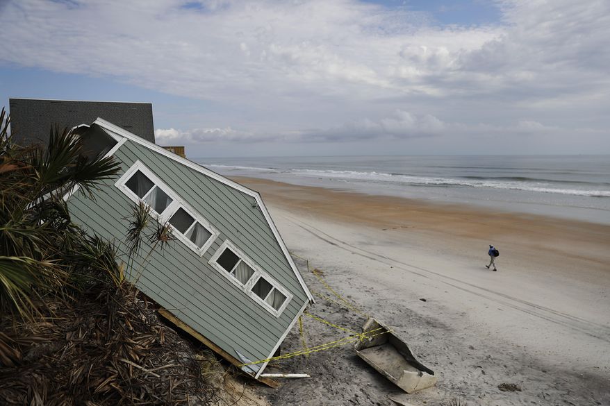 A house rests on the beach after collapsing off a cliff from Hurricane Irma in Vilano Beach, Fla., Friday, Sept. 15, 2017. Florida’s economy has long thrived on one major import: people. Irma raised concerns about just how sustainable the allure of Florida’s year-round warmth and lifestyle are. The wind, rain and flooding inflicted an estimated $50 billion in damage. (AP Photo/David Goldman)