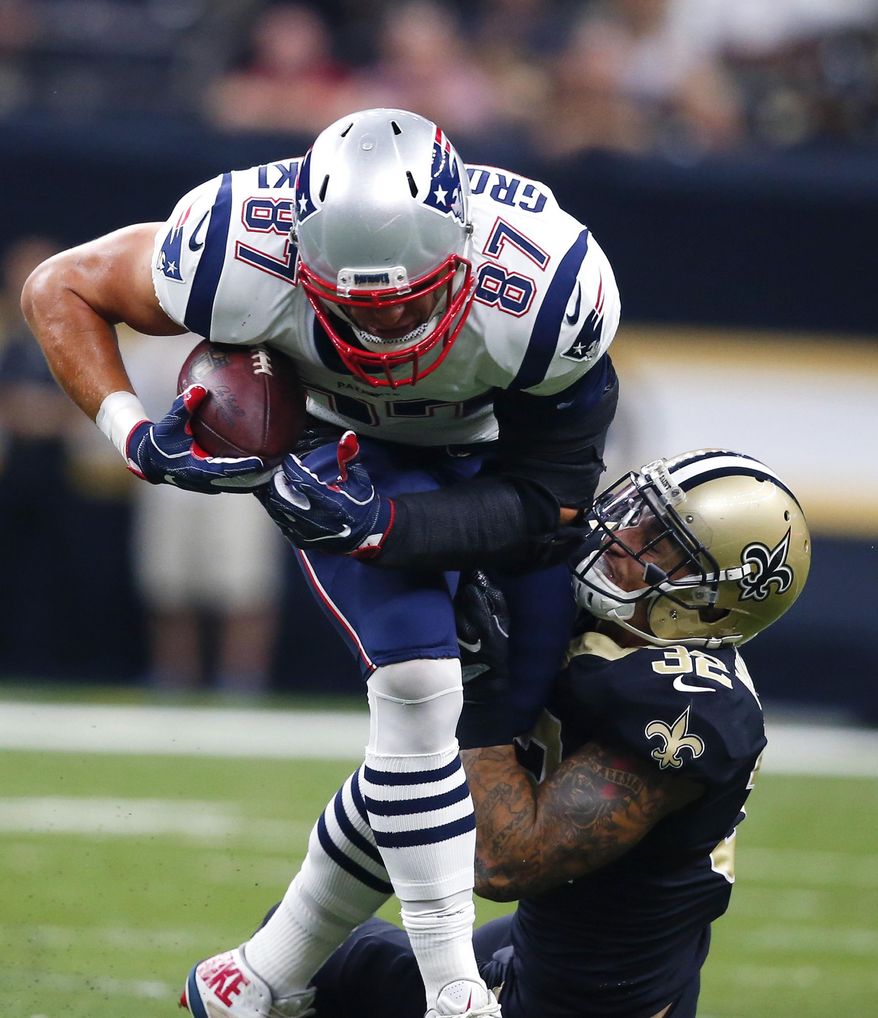 New England Patriots tight end Rob Gronkowski (87) carries against New Orleans Saints strong safety Kenny Vaccaro (32) in the first half of an NFL football game in New Orleans, Sunday, Sept. 17, 2017. (AP Photo/Butch Dill)