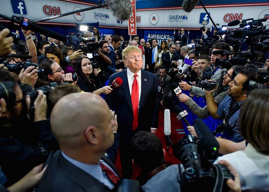 President Trump's relationship with the press has not changed much since this encounter then-candidate Trump had with reporters. (Associated Press)
