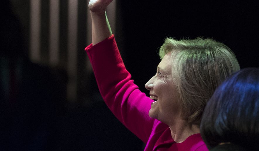 Hillary Clinton waves to the audience at the Warner Theatre in Washington, Monday, Sept. 18, 2017, for book tour event for her new book &quot;What Happened&quot; hosted by the Politics and Prose Bookstore. (AP Photo/Carolyn Kaster)