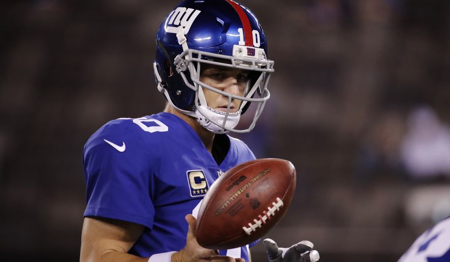 New York Giants' Eli Manning warms up before an NFL football game against the Detroit Lions Monday, Sept. 18, 2017, in East Rutherford, N.J. (AP Photo/Julio Cortez)