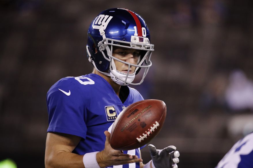 New York Giants' Eli Manning warms up before an NFL football game against the Detroit Lions Monday, Sept. 18, 2017, in East Rutherford, N.J. (AP Photo/Julio Cortez)