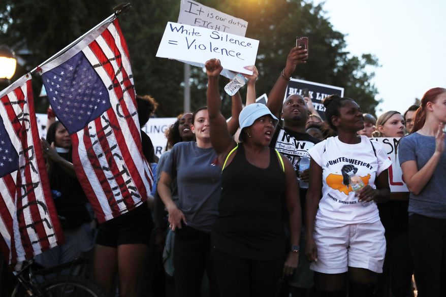 Demonstrators march in response to a not guilty verdict in the trial of former St. Louis police officer Jason Stockley Saturday, Sept. 16, 2017, in St. Louis. Stockley was acquitted in the 2011 killing of a black man following a high-speed chase. (AP Photo/Jeff Roberson)