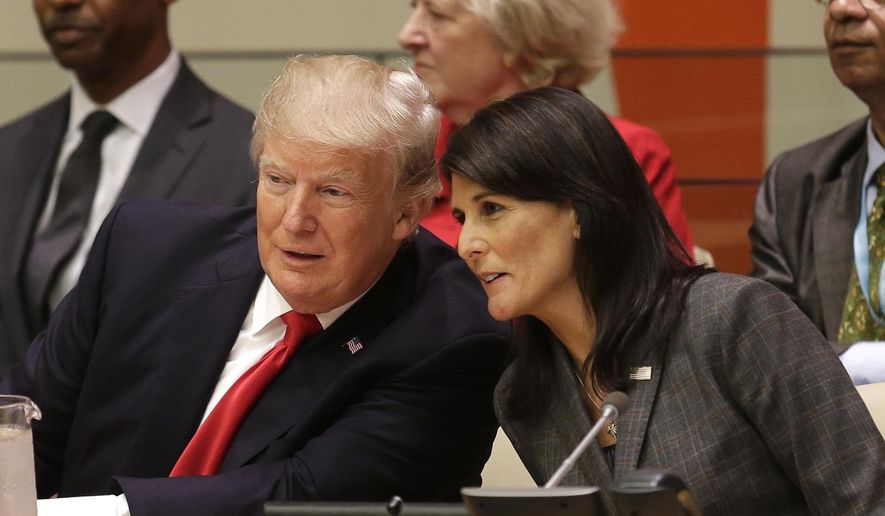United States President Donald Trump speaks with U.S. Ambassador to the United Nations Nikki Haley before a meeting during the United Nations General Assembly at U.N. headquarters, Monday, Sept. 18, 2017. (AP Photo/Seth Wenig) ** FILE **