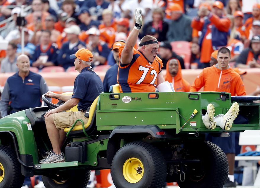 Denver Broncos offensive tackle Garett Bolles (72) is helped off the field after an injury against the Dallas Cowboys during the second half of an NFL football game, Sunday, Sept. 17, 2017, in Denver. Broncos coach Vance Joseph says rookie tackle Garett Bolles' left leg injury isn't as serious as first feared. Joseph says Bolles has a bone bruise in his lower left leg and is week to week. The Broncos' first-round draft pick was injured in Denver's win over Dallas. (AP Photo/Joe Mahoney)