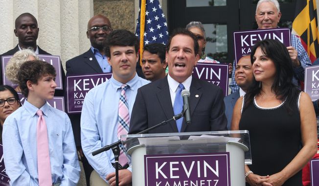 Baltimore County Executive Kevin Kamenetz announces he is joining the race for governor Monday, Sept. 18, 2017, in Towson, Md. Kamenetz is running in a crowded Democratic primary. From left are Kamenetz&#x27;s sons, Dylan and Karson. His wife, Jill, is standing far right. (AP Photo/Brian Witte)
