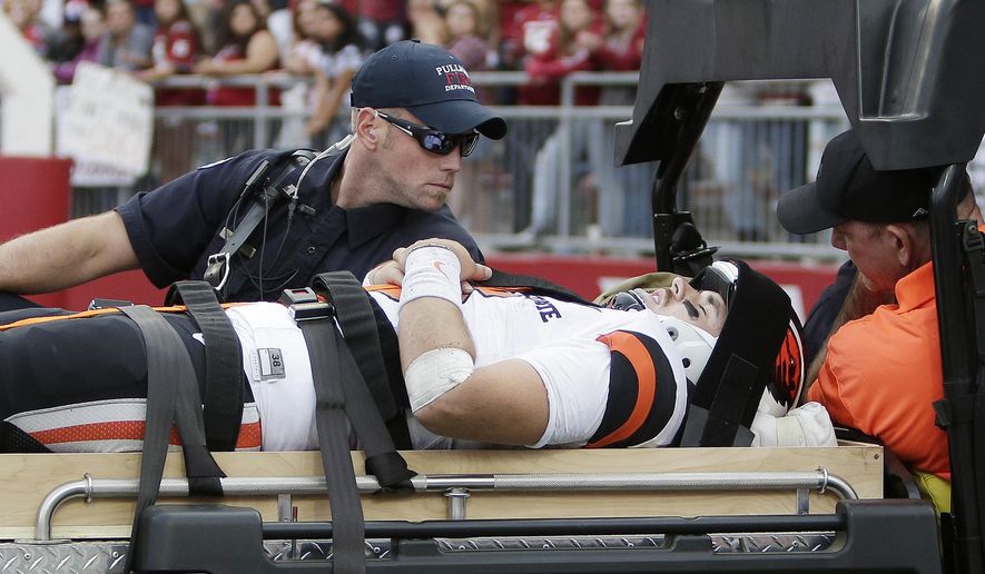 Oregon State quarterback Jake Luton is carted off the field after suffering an injury during the second half of an NCAA college football game in Pullman, Wash., Saturday, Sept. 16, 2017. Washington State won 52-23. (AP Photo/Young Kwak)