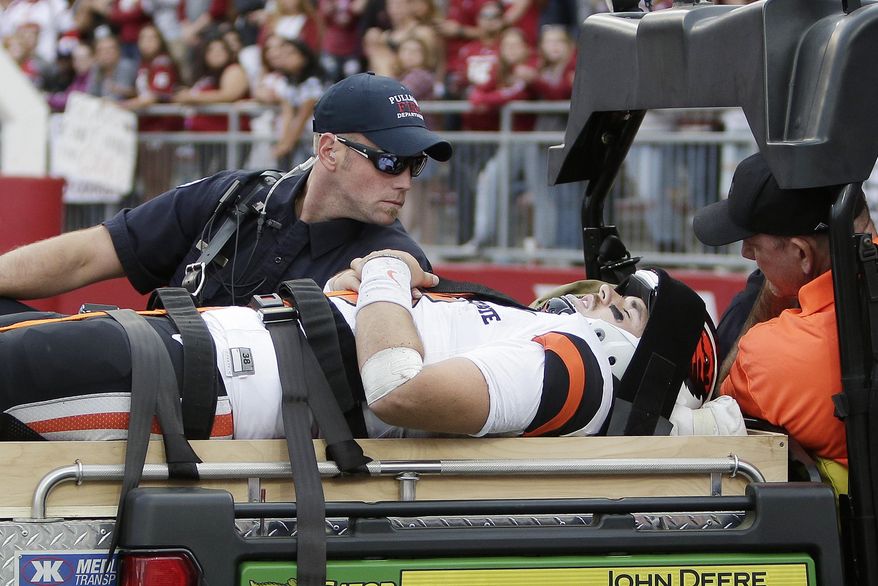 Oregon State quarterback Jake Luton is carted off the field after suffering an injury during the second half of an NCAA college football game in Pullman, Wash., Saturday, Sept. 16, 2017. Washington State won 52-23. (AP Photo/Young Kwak)