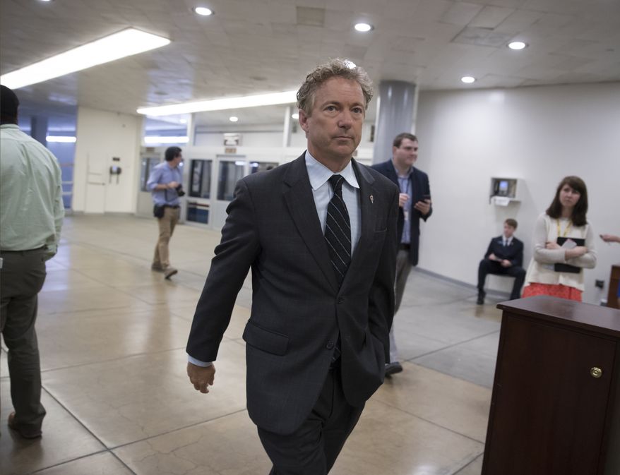 Sen. Rand Paul, R-Ky., walks to the Senate chamber for a vote, at the Capitol in Washington, Tuesday, Sept. 19, 2017. (AP Photo/J. Scott Applewhite)