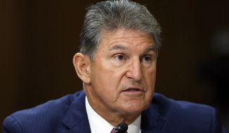 Sen. Joe Manchin, D-W.Va., testifies during a hearing of the Senate Foreign Relations Committee on the nomination of former Utah Gov. Jon Huntsman to become the US ambassador to Russia, on Capitol Hill, Tuesday, Sept. 19, 2017 in Washington. (AP Photo/Alex Brandon)