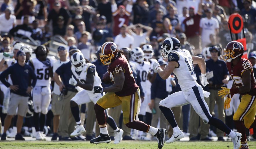 Washington Redskins inside linebacker Mason Foster carries the ball for a touchdown during an NFL football game against the Los Angeles Rams Sunday, Sept. 17, 2017, in Los Angeles. (AP Photo/Jae C. Hong) **FILE**