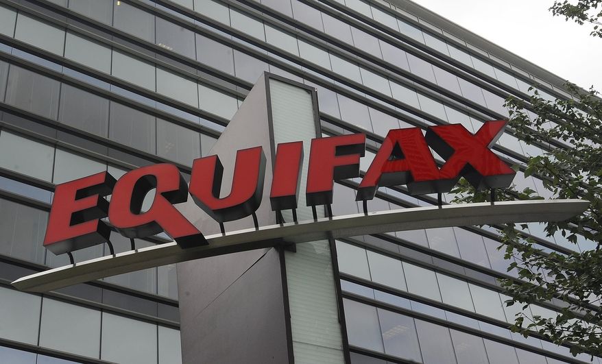 This Saturday, July 21, 2012, photo shows signage at the corporate headquarters of Equifax Inc. in Atlanta. (AP Photo/Mike Stewart)