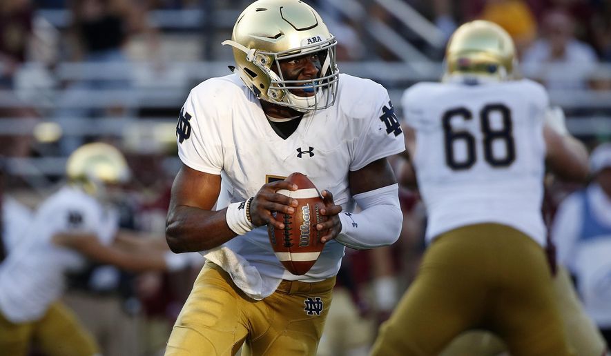 Notre Dame's Brandon Wimbush looks to pass during the second half of an NCAA college football game against Boston College in Boston, Saturday, Sept. 16, 2017. Notre Dame won 49-20. (AP Photo/Michael Dwyer)