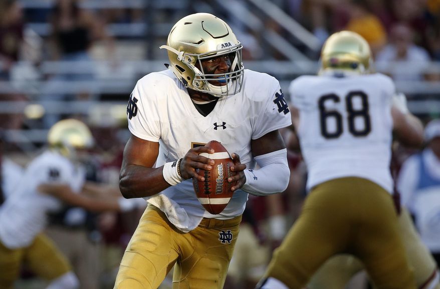 Notre Dame's Brandon Wimbush looks to pass during the second half of an NCAA college football game against Boston College in Boston, Saturday, Sept. 16, 2017. Notre Dame won 49-20. (AP Photo/Michael Dwyer)