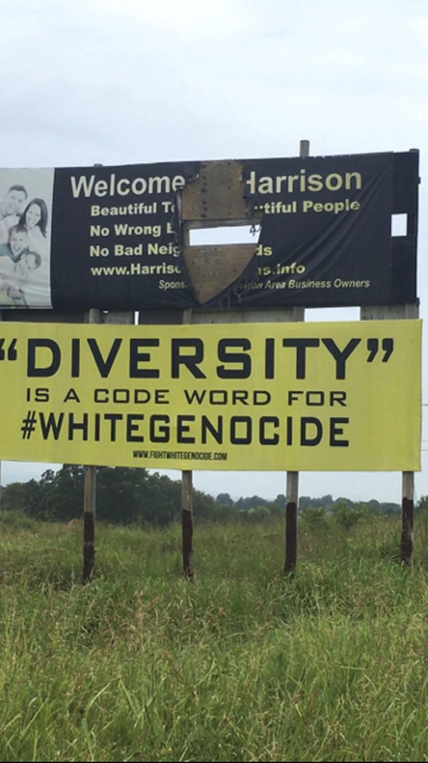This undated photo provided by Kelsey Bardwell shows a racially charged billboard in Harrison, Ark. Two such billboard signs have been removed at the request of the north Arkansas property owner. Carrie Myers says that when she leased the billboards three years ago she didn&#39;t imagine they would have messages such as &amp;quot;Diversity is a code word for white genocide.&amp;quot; The signs were taken down after Attorney Cathy Golden and colleague Kelsey Bardwell found the permits for the signage had expired. (Photo Courtesy Kelsey Bardwell via AP)