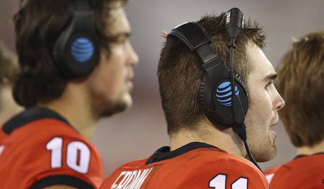 Georgia quarterbacks Jacob Eason, left, who is injured, and current starter Jake Fromm watch during the fourth quarter against Samford from the sidelines during the team's 42-14 victory in an NCAA college football game Saturday, Sept. 16, 2017, in Athens, Ga. (Curtis Compton/Atlanta Journal-Constitution via AP)